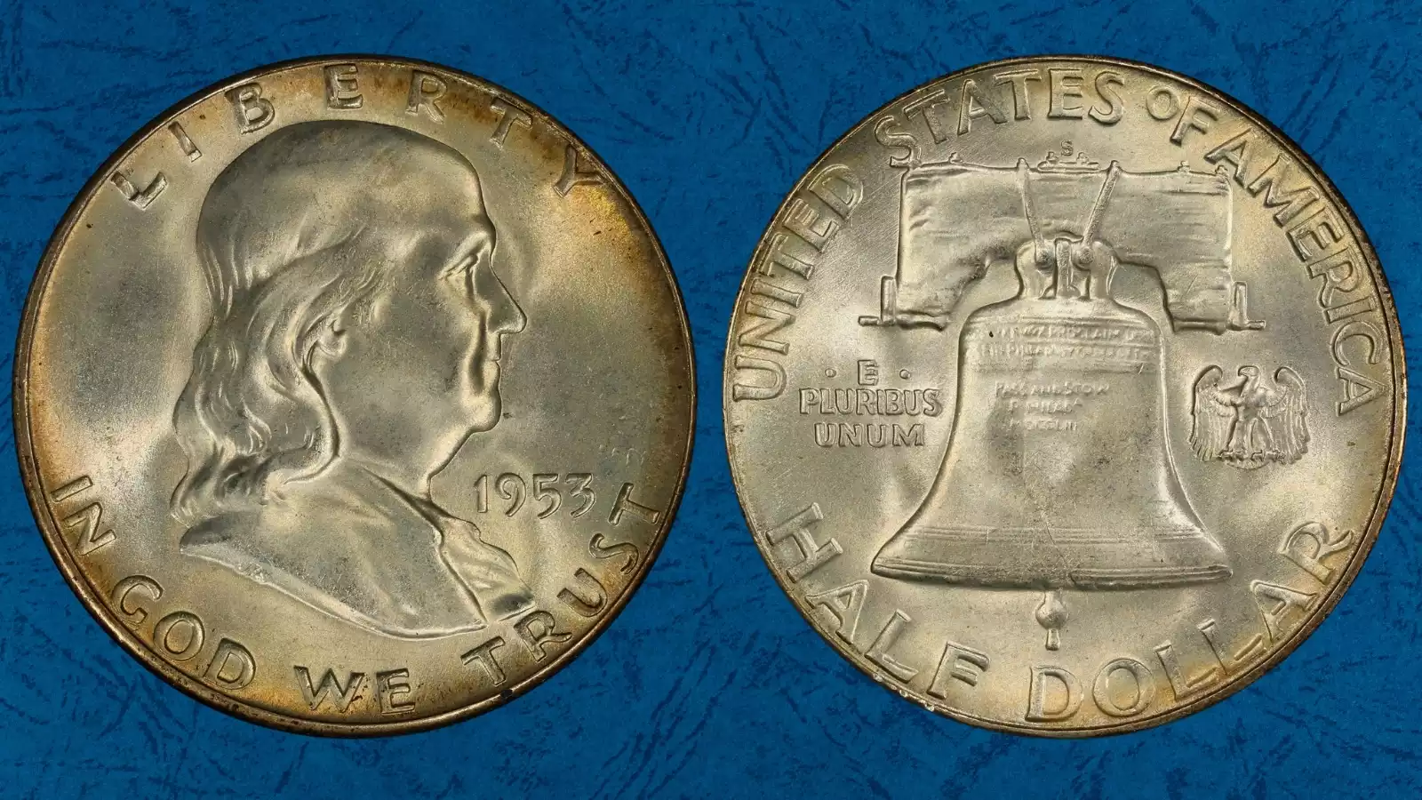 Group of 1953 Franklin half dollar varieties including Philadelphia, Denver, San Francisco, and Proof issues arranged for comparison